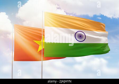 Sunny blue sky and flags of india and vietnam Stock Photo