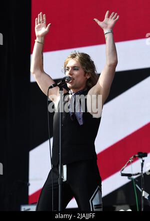 Lead singer Luke Spiller is shown performing on stage during a live concert appearance The Struts during the Boston Calling music festival held in Allston, Massachusetts on May 27, 2022. Stock Photo