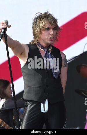 Lead singer Luke Spiller is shown performing on stage during a live concert appearance The Struts during the Boston Calling music festival held in Allston, Massachusetts on May 27, 2022. Stock Photo