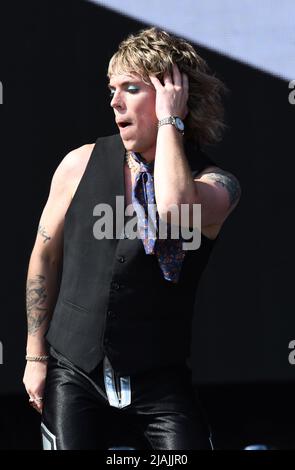 Lead singer Luke Spiller is shown performing on stage during a live concert appearance The Struts during the Boston Calling music festival held in Allston, Massachusetts on May 27, 2022. Stock Photo