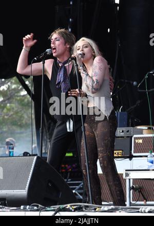 Lead singer Luke Spiller and special guest Paris Jackson are shown performing on stage during a live concert appearance The Struts during the Boston Calling music festival held in Allston, Massachusetts on May 27, 2022. Stock Photo