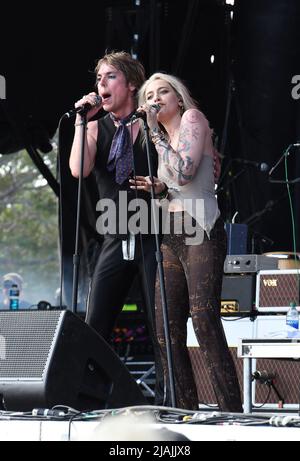 Lead singer Luke Spiller and special guest Paris Jackson are shown performing on stage during a live concert appearance The Struts during the Boston Calling music festival held in Allston, Massachusetts on May 27, 2022. Stock Photo