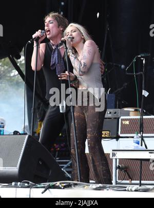 Lead singer Luke Spiller and special guest Paris Jackson are shown performing on stage during a live concert appearance The Struts during the Boston Calling music festival held in Allston, Massachusetts on May 27, 2022. Stock Photo