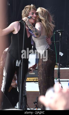 Lead singer Luke Spiller and special guest Paris Jackson are shown performing on stage during a live concert appearance The Struts during the Boston Calling music festival held in Allston, Massachusetts on May 27, 2022. Stock Photo