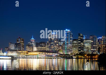 Downtown Vancouver skyline and the Vancouver harbour as seen from Stanley Park at dusk. Stock Photo