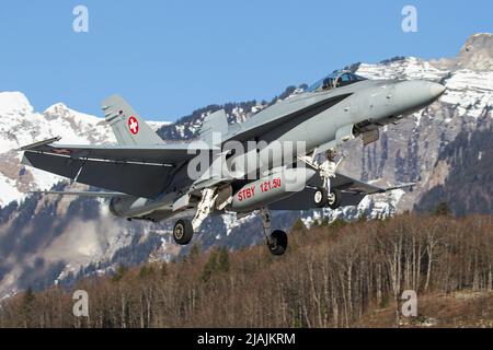 A Swiss Air Force F/A-18 Hornet comes in for landing at its homebase Meiringen, Switzerland. Stock Photo