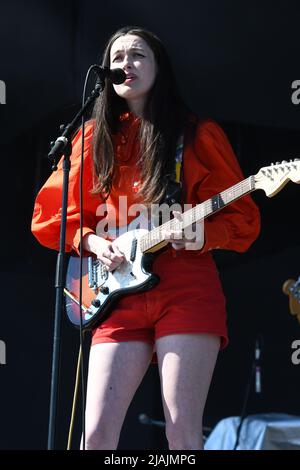 Singer Madeline Follin is shown performing on stage during a live concert appearance with Cults at the Boston Calling music festival in Allston, Massachusetts on May 29, 2022. Stock Photo