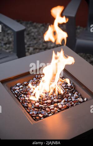 An outdoor gas fireplace. Stock Photo