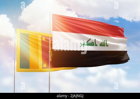 Sunny blue sky and flags of iraq and sri lanka Stock Photo