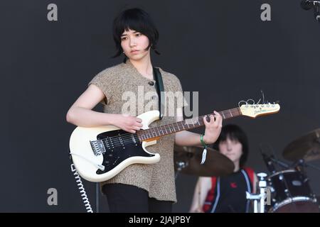 Singer, songwriter and guitarist Nora Cheng is shown performing on stage during a live concert appearance with Horsegirl at the Boston Calling music festival in Allston, Massachusetts on May 29, 2022. Stock Photo