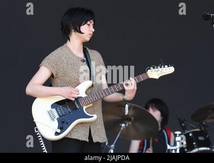 Singer, songwriter and guitarist Nora Cheng is shown performing on stage during a live concert appearance with Horsegirl at the Boston Calling music festival in Allston, Massachusetts on May 29, 2022. Stock Photo