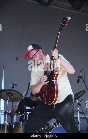 Lead guitarist Bjarki Gudmundsson is shown performing on stage during a