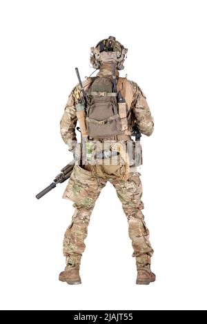 Army soldier in camouflage uniform wearing backpack, rear view isolated on white background. Stock Photo