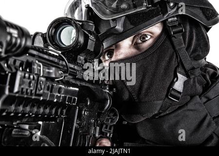 Close-up studio portrait of SWAT team shooter aiming service rifle with optical  sight Stock Photo - Alamy