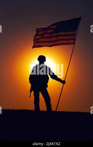 Sunset and American flags on Memorial Day at a national cemetery in ...