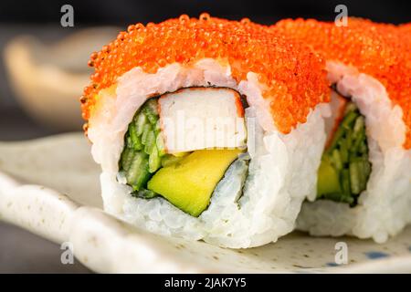 Sushi set of various products on a black stone plate Stock Photo