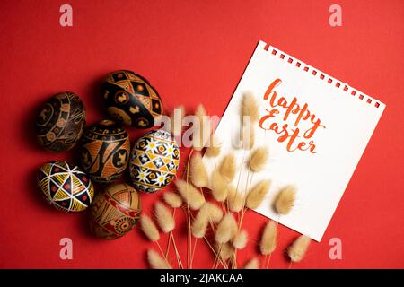 happy easter card. beautiful Easter egg Pysanka handmade  with the inscription happy easter Stock Photo