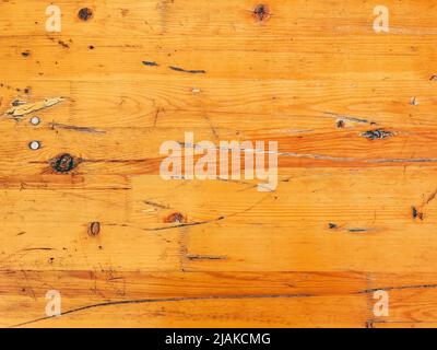 Worn wooden plank surface as grunge background Stock Photo