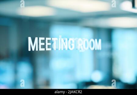 Close-up of glass door of meeting room at modern office Stock Photo