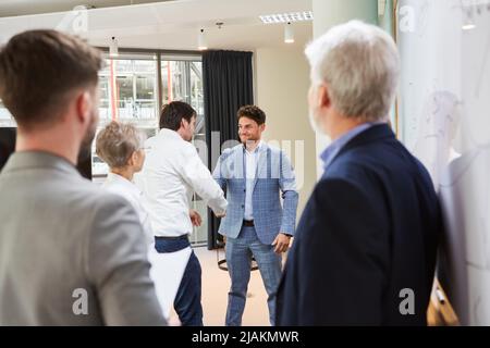 Two business partners handshake in office for business deal and partnership Stock Photo