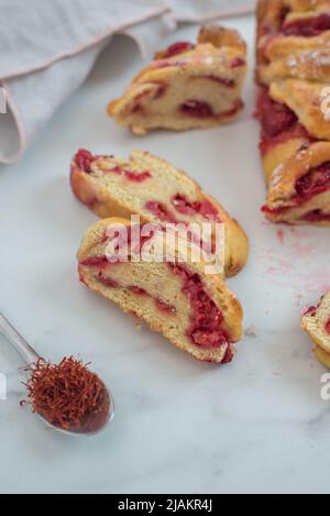 sweet home made saffron babka brioche with raspberries Stock Photo