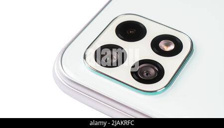 Camera of a modern smartphone close-up. Modern smartphone camera lens isolated. Stock Photo