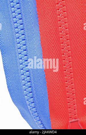 close-up of a blue and red zipper isolated on white background Stock Photo