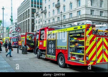 London, UK. 31st May, 2022. Fire engines wait outside - London Fire Brigade, the Police and the Ambulance sevice, including the Air Ambulance attend an incident at Green Park tube station. It was reported that there was a person under a train but the air ambulance was not needed and the the mergency services left soon after. Credit: Guy Bell/Alamy Live News Stock Photo