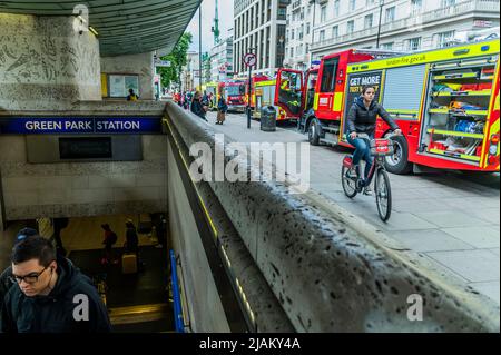 London, UK. 31st May, 2022. Fire engines wait outside - London Fire Brigade, the Police and the Ambulance sevice, including the Air Ambulance attend an incident at Green Park tube station. It was reported that there was a person under a train but the air ambulance was not needed and the the mergency services left soon after. Credit: Guy Bell/Alamy Live News Stock Photo