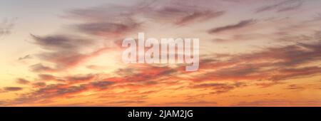 Colored sunset clouds in the sky. Natural panoramic texture and background Stock Photo