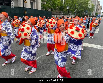 Japanese Folk Dance group perform down Central Park West at the first annual Japanese Day Parade in New York City. Dancers are from the Japanese Folk Dance Institute. Stock Photo