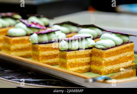 Several puff small pieces of cakes on a plate Stock Photo
