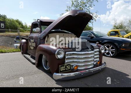 Three-quarters front view of a Brown, Hot Rod, based on a 1950, Chevrolet 3100  Truck, on display at the Deal Classic Car Show 2022 Stock Photo