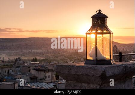 turkish lantern at a Cappadocia sunrise over the city of Göreme Stock Photo