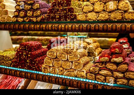 Traditional Turkish delights sweet rolls, Oriental sweets lukum, lokum, nougat Stock Photo