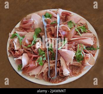 A Cold Cooked Meat Platter on a Food Buffet. Stock Photo