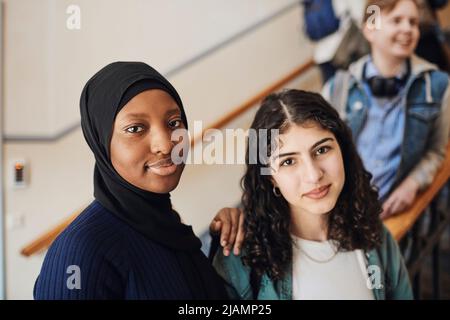 Portrait of multiracial female students in university Stock Photo