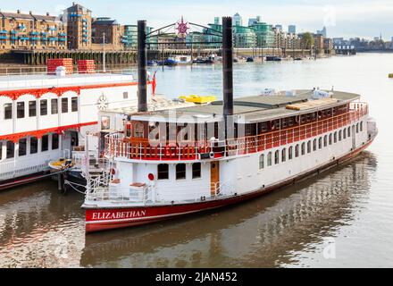 London, UK - Nov 1, 2012: The Elizabethan replica paddle steamer moored on the River Thames next to the Tower Bridge Stock Photo