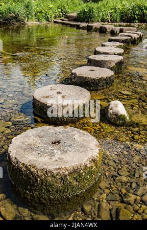Stepping stones  that are well clear of quiet  water on he River Aire in Gargrave, North Yorkshire, during a drier spell Stock Photo