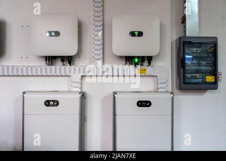 Huawei inverters and lithium batteries part of a photovoltaic solar panels system Stock Photo
