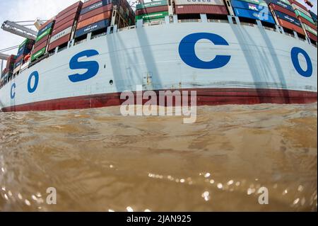 COSCO Development container ship, the largest vessel to call on the East Coast, entered the Savannah River Harbor, heading to Georgia Ports Authority Stock Photo