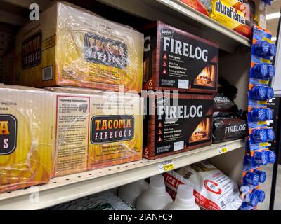 Woodinville, WA USA - circa May 2022: Angled view of indoor fire logs for sale inside a Haggen grocery store Stock Photo