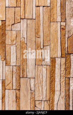 Rock stone brick tile wall has a detailed background texture sepia cream brown color stacked in layers, you can use this image as a background image Stock Photo