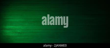 Green wooden table background wood texture. Dark green rustic plank surface. Panoramic high resolution wood texture. Stock Photo