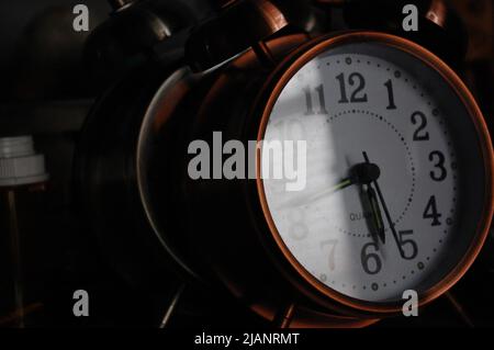 Two old fashioned Alarm clocks with different colors Stock Photo