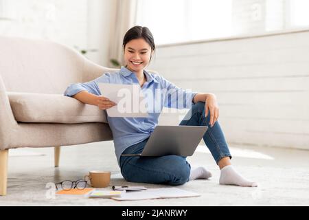 https://l450v.alamy.com/450v/2janrwy/positive-japanese-woman-working-from-home-using-laptop-2janrwy.jpg