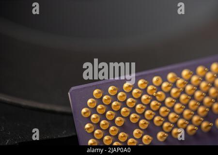 Closeup of microprocessor pins. Gold connectors of CPU, Central processing unit or main processor Stock Photo