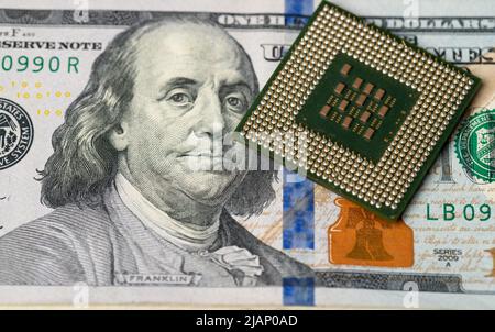 Central processing unit, CPU on one hundred dollar banknote. Money and technology concept Stock Photo