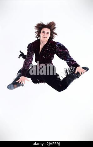 Gypsy male dancer in traditional dress performs folk dance Stock Photo
