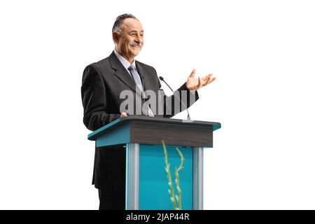 Politician giving a speech on a podium and smiling isolated on white background Stock Photo